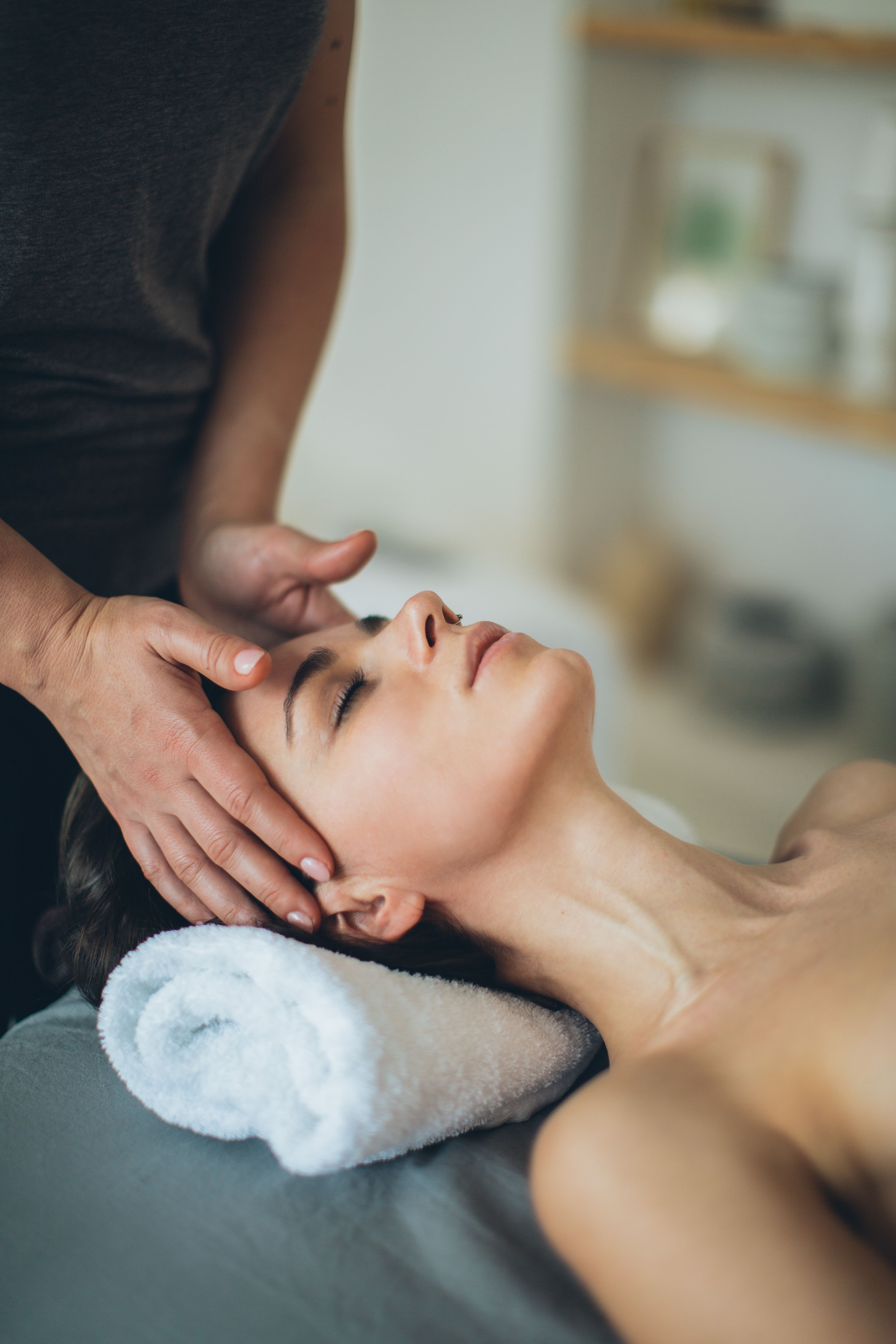 Esthetician performing a facial treatment